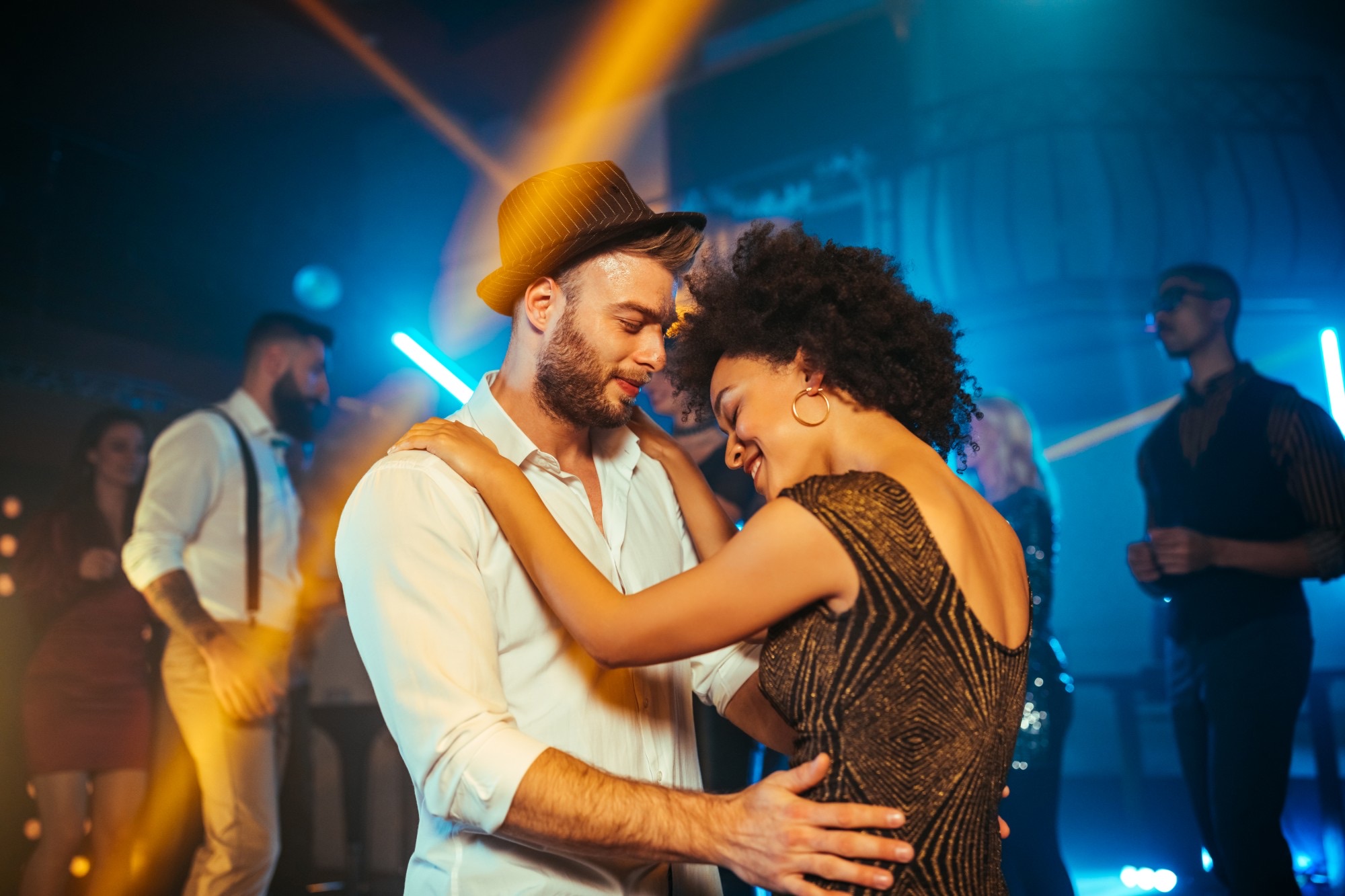 Couple dancing bachata at a social night